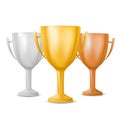 Realistic isolated winner cup. Gold, silver and bronze trophy on white background Royalty Free Stock Photo