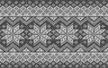 Realistic knitted background with snowflakes. Vector seamless texture of wool gray knit. Norwegian pattern. Template of