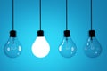 Realistic lightbulbs on blue background in 3D rendering