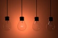 Realistic lightbulbs on orange background in 3D rendering