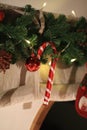 Realistic Looking Christmas Tree Branches Decorated with gold, red balls and Candy Canes.