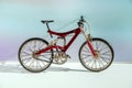 Realistic model of toy metal full-suspension mountain bike. Miniature bicycle on colored background