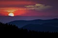Realistic mountains landscape. Morning forest panorama, rising sun, clouds and mountains silhouettes
