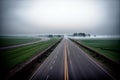 Realistic photo bird view of the empty highway through the fields in a fog Royalty Free Stock Photo