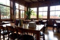 Realistic photo of book on wood desk in a library study room with cozy atmosphere