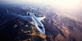 Realistic photo of silver generic design private Jet flying over the mountains. Empty blue sky with sun at background Royalty Free Stock Photo
