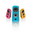 Realistic pink, blue and orange music speakers in the front and