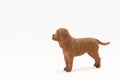 Realistic plastic toy dog isolated on white background Royalty Free Stock Photo