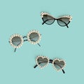 Realistic posh sunglasses decorated with pearls over turquoise background. Vector Royalty Free Stock Photo