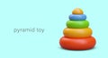 Realistic pyramid toy on blue background. Pyramid with colorful rings for toy store placard