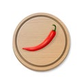 Realistic red hot chili pepper icon on a round cutting board. Royalty Free Stock Photo