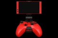 Realistic red joystick for playing games on a mobile phone on black background Royalty Free Stock Photo