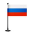 Realistic Russian table flag on a black steel pole. Souvenir from Russia. Desk flag made of paper or fabric and shiny
