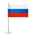 Realistic Russian table flag on a chrome steel pole. Souvenir from Russia. Desk flag made of paper or fabric and shiny