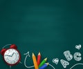 Realistic school supplies on a green chalkboard with children`s drawings. Back to school concept background.