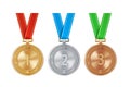 Realistic set of golden, silver, and bronze medals on colorful ribbons. Sports competition awards for 1st, 2nd, and 3rd place. Royalty Free Stock Photo