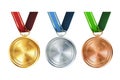 Realistic set of golden, silver, and bronze medals on colorful ribbons. Sports competition awards for 1st, 2nd, and 3rd place. Royalty Free Stock Photo