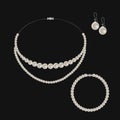 Realistic set of jewelry: pearl necklace, bracelet and earrings. Isolated on black background Royalty Free Stock Photo