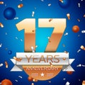 Realistic Seventeen Years Anniversary Celebration Design. Golden numbers and silver ribbon, confetti on blue background