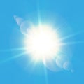 Realistic shining sun with lens flare. Blue sky with clouds background. Vector illustration. Royalty Free Stock Photo