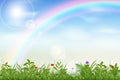 Realistic sky clouds, grass garden. Spring green lawn, blue air with clouds and rainbow, bright sun, outdoor environment Royalty Free Stock Photo