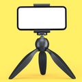 Realistic smartphone with blank white screen on black tripod isolated on yellow Royalty Free Stock Photo
