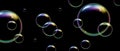 Realistic soap bubbles with rainbow reflection on black background. Vector water foam bubbles. Colorful iridescent glass sphere.