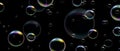 Realistic soap bubbles with rainbow reflection on black background. Vector water foam bubbles. Colorful iridescent glass sphere.