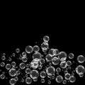 Realistic soap bubbles with rainbow reflection set isolated on the black background. Royalty Free Stock Photo