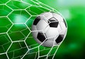Realistic Soccer football ball in the goal net on the green grass background, vector illustration Royalty Free Stock Photo