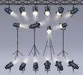 Realistic spotlights. Lamp on tripod stand, photo studio or stage light equipment. Spotlight with light beam glow effect