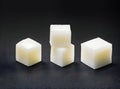 realistic sugar cubes on black background POV