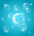 Realistic Transparent Soap Bubbles with Reflection on Blue Background Royalty Free Stock Photo