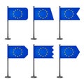 Realistic various European table flags on a black steel pole. Souvenir from Europe. Desk flag made of paper or fabric