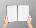 Realistic vector hands holding blank open book isolated on grey background Royalty Free Stock Photo