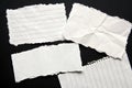 White torn paper with black background Royalty Free Stock Photo
