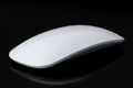 Realistic white wireless computer mouse with touch isolated on black background. Royalty Free Stock Photo