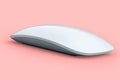 Realistic white wireless computer mouse with touch isolated on pink background. Royalty Free Stock Photo