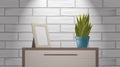Realistic woden picture frame mock up and green home plant standing on commode.