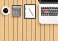 Realistic workplace desktop. Top view desk table on wood. With metal pencil, mobile smartphone, coffee, calculator and laptop. Royalty Free Stock Photo