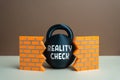 Reality check breaks down false ideas and misconceptions. Facing truth and overcoming illusion Royalty Free Stock Photo