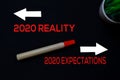 2020 Reality or 2020 Expectations write on black board background Royalty Free Stock Photo