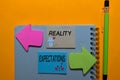 Reality or Expectations write on sticky notes isolated on Office Desk Royalty Free Stock Photo