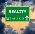 REALITY road sign against clear blue sky Royalty Free Stock Photo