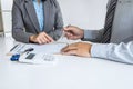 Realtor agent manager pointing rental contract form to businessman client for decide signing to agreement, renting considering Royalty Free Stock Photo