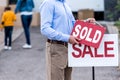 realtor hanging sold sign Royalty Free Stock Photo