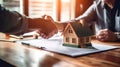 A realtor presenting a title deed to a new homeowner, symbolizing the official transfer of ownership.