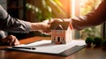 A realtor presenting a title deed to a new homeowner, symbolizing the official transfer of ownership.