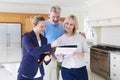 Realtor Shows Mature Couple Around House