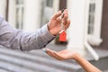 Realtor standing outside modern house